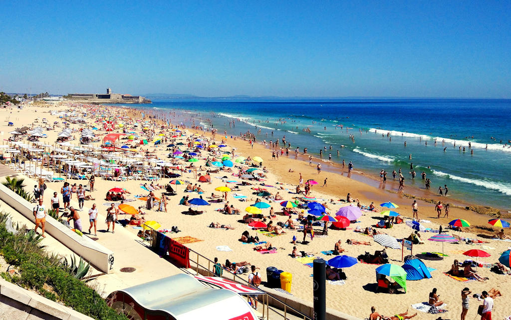 Praia da Carcavelos invites you to enjoy thrilling surf, beach sports, and coastal dining on the vibrant Lisbon coast.