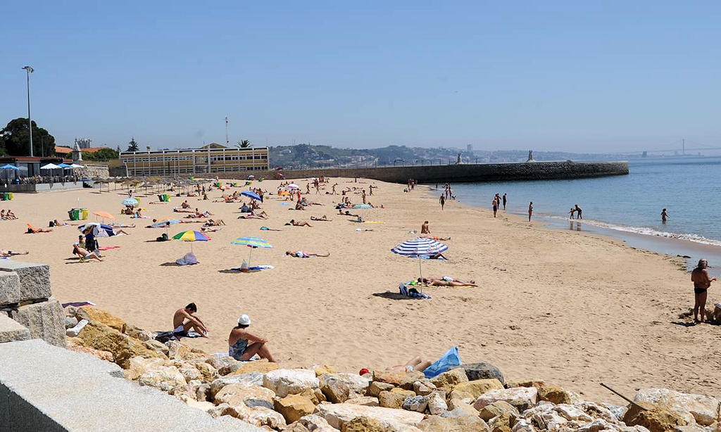 Experience the beauty of Praia de Paço de Arcos, a captivating beach near Lisbon, where golden sands meet thrilling water sports and breathtaking views of the Atlantic Ocean.