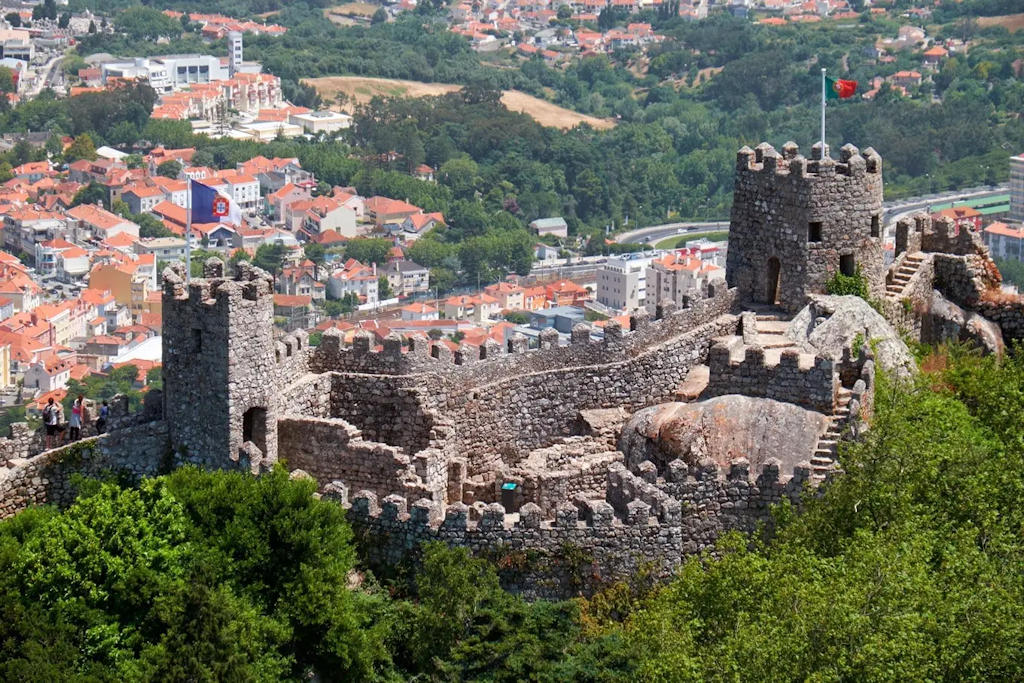 Uncover the fascinating history and breathtaking views of Sintra's Castle of the Moors—a medieval fortress nestled amidst Portugal's enchanting natural beauty.