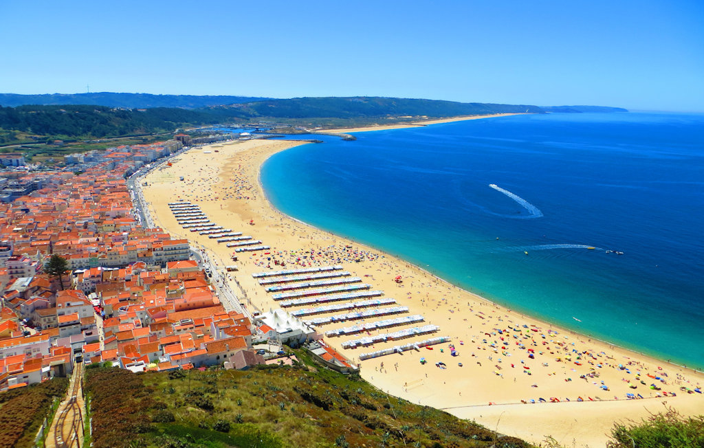 Experience the thrill of surfing legendary waves, savor fresh seafood, and explore the cultural heritage of Nazaré, Portugal, a captivating coastal town along the Atlantic Ocean.