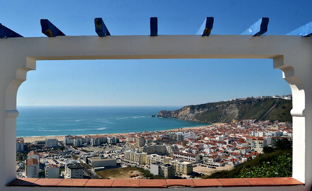 Experience Nazaré's breathtaking panoramic views at Miradouro da Pederneira and immerse yourself in the authentic charm of this coastal town on a recommended day trip from Lisbon.