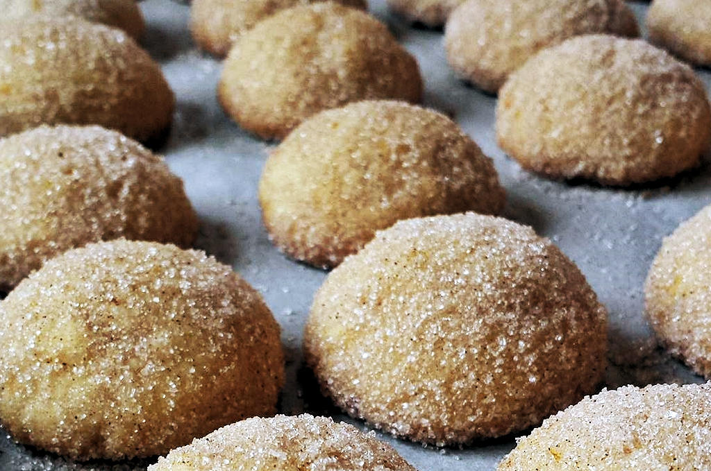 Indulge in the irresistible flavors of Areias, Portugal's traditional dessert of sweet dough balls coated in a delightful sugar and cinnamon embrace.