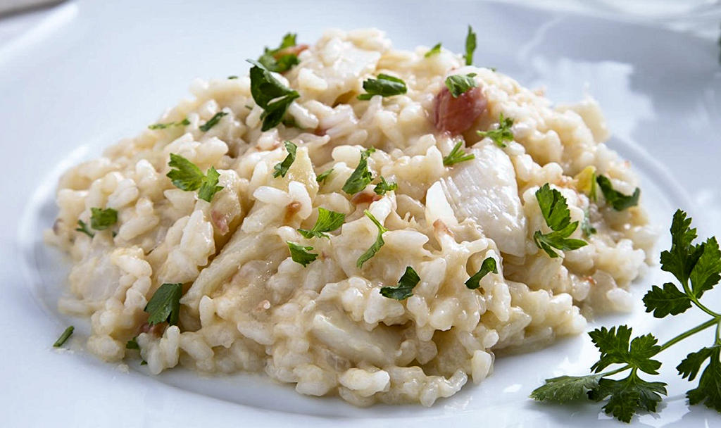 Arroz de Bacalhau: A Portuguese culinary treasure that blends salt codfish and short-grain rice in perfect harmony.