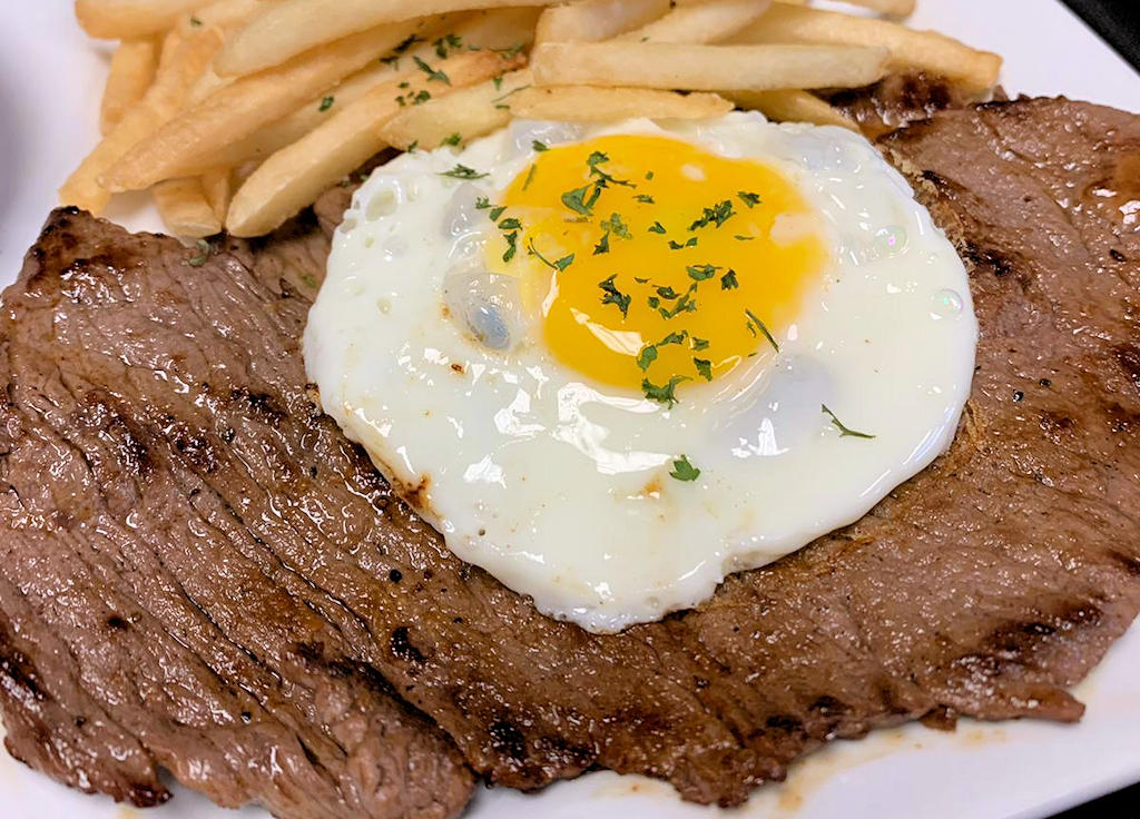 Bife a Cavalo: A Portuguese classic where grilled steak and fried eggs unite in delicious harmony.