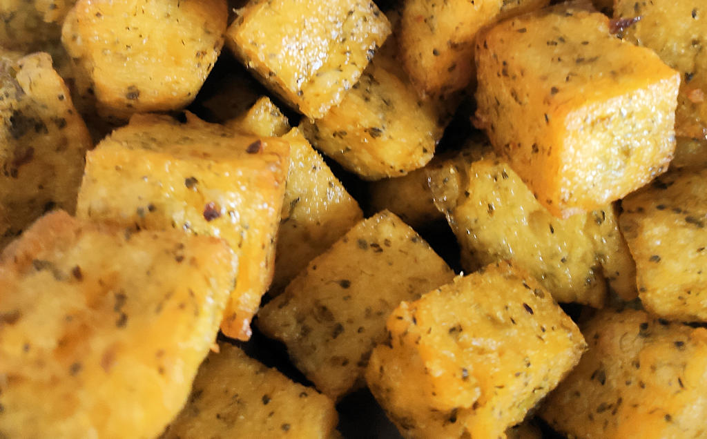 Milho Frito: The crispy, golden cornmeal snack that embodies Madeira's culinary heritage.