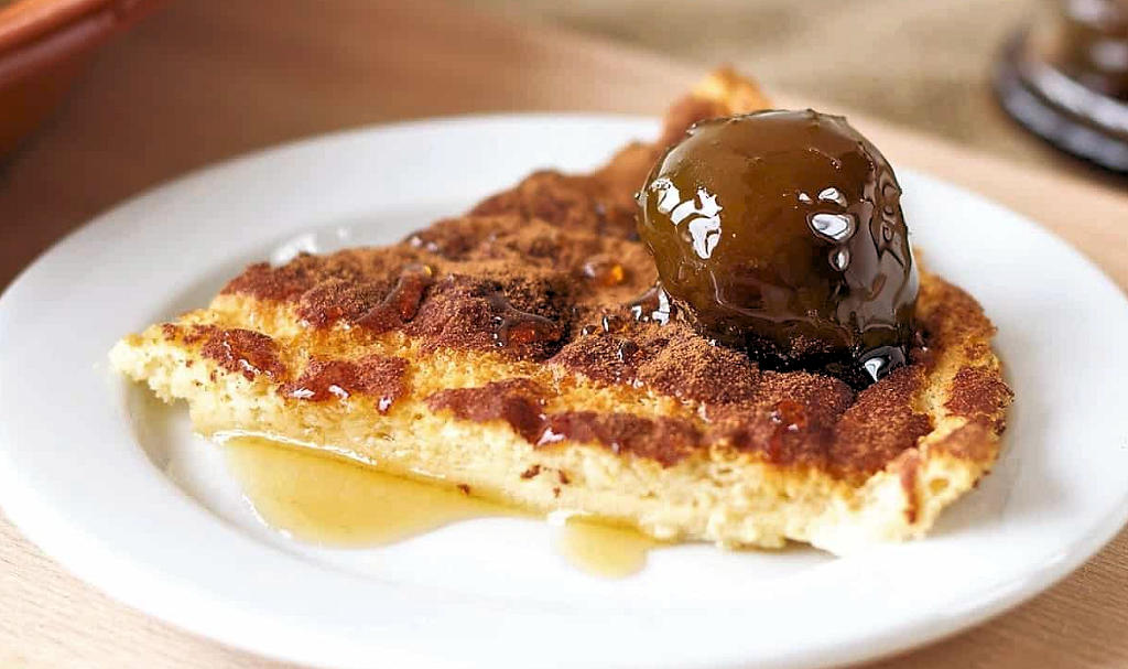 Savor the cracked surface, creamy texture, and hint of cinnamon in Sericaia, a traditional Portuguese dessert that unveils Lisbon's culinary heritage.