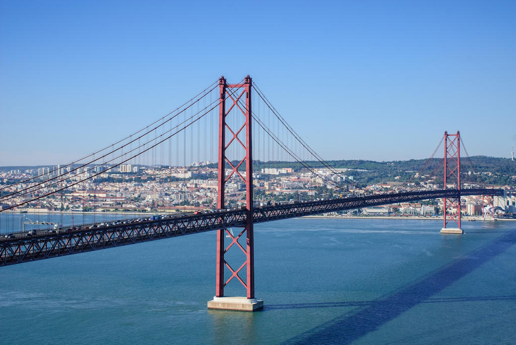Discover the iconic 25 de Abril Bridge in Lisbon, a symbol of freedom and an engineering marvel spanning the Tagus River.