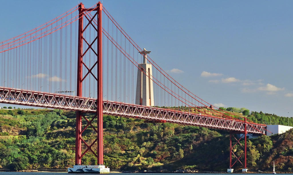 Experience the awe-inspiring Christ the King Monument in Lisbon, a symbol of faith and gratitude overlooking the city, offering panoramic views and a sanctuary of serenity.