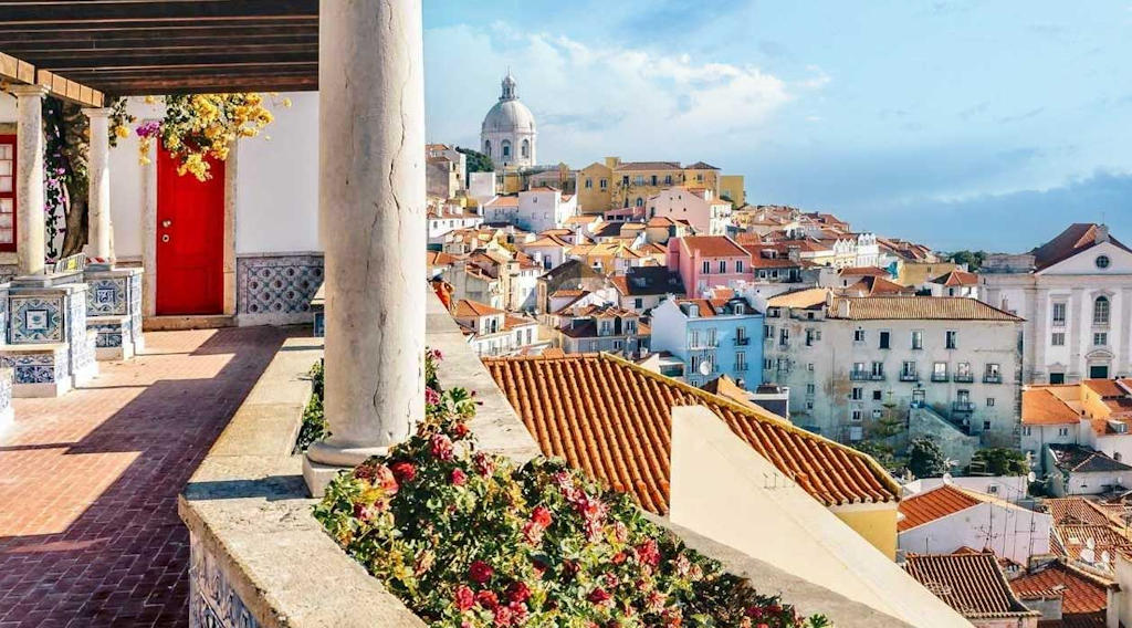 Marvel at the panoramic views, intricate tile work, and serene ambiance of Miradouro de Santa Luzia—a captivating viewpoint in Lisbon's historic Alfama district.